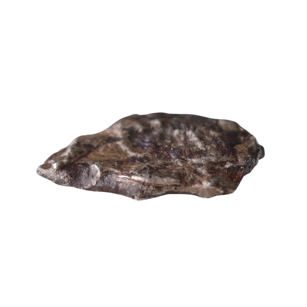 Close-up of the rare MBS Meteorite Mdeïne 003 iron meteorite showing textured metallic surface and natural crystalline patterns.