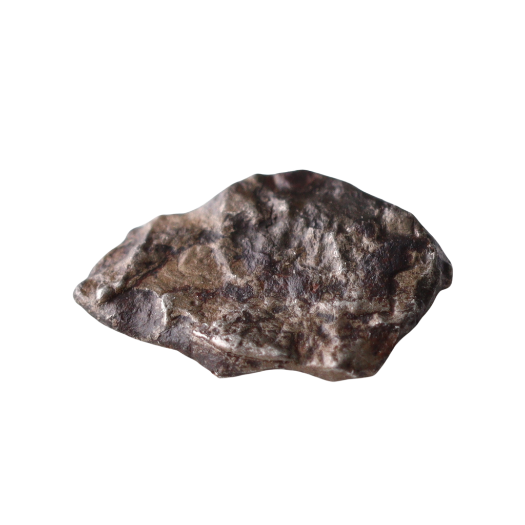Ungrouped iron meteorite Mdeïné 003 by MBS Meteorite with a golden hue, showing textured metallic surface.