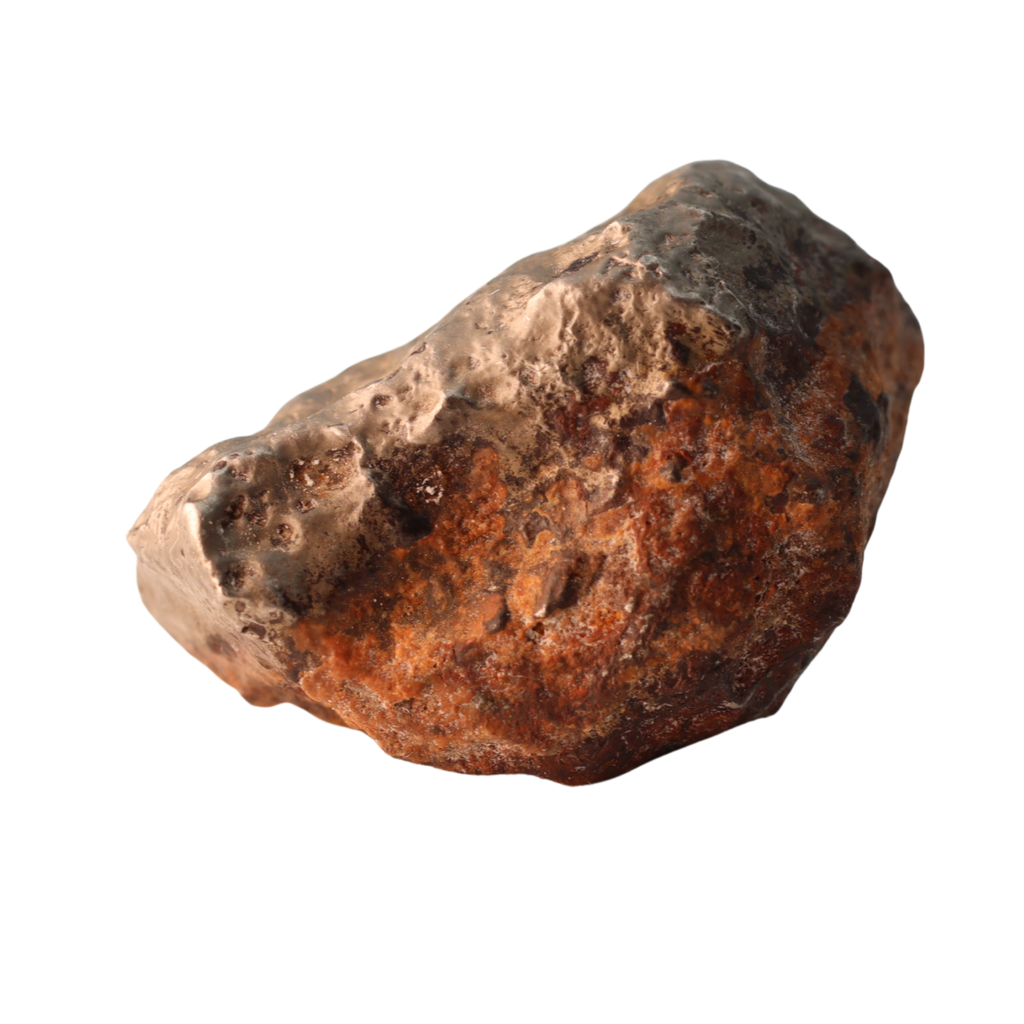 Golden MBS meteorite Mdeïné 003, rare ungrouped iron meteorite with a shiny, textured surface, weighing 24.42g.